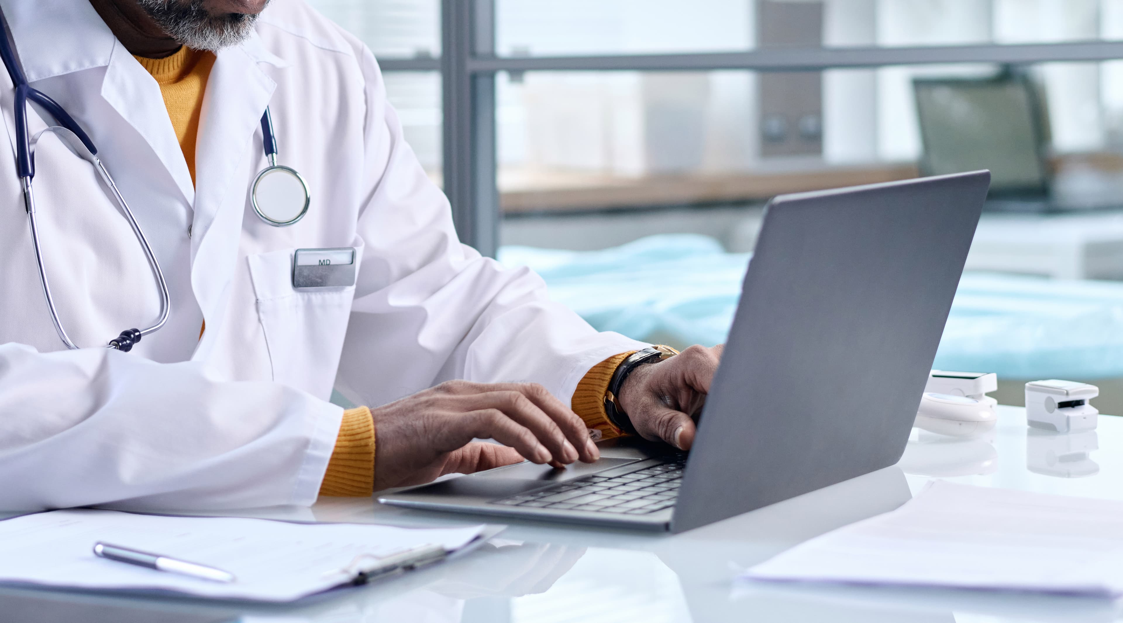 _doctor-working-on-laptop-in-modern-office-2026-03-24-07-41-21-utc copy.jpg